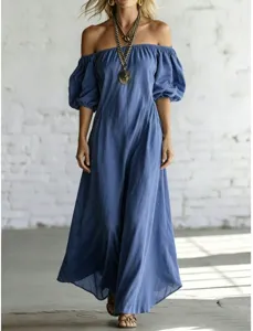 Detail shot of the elegant blue off-the-shoulder puff sleeve maxi dress with drapers.