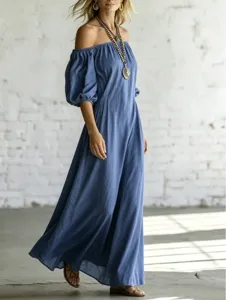 Detail view of the elegant off-shoulder puff sleeve maxi dress with flowing drape.