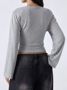 Casual grey long sleeve top with drop shoulders and bell sleeves, trendy minimalist style.