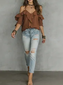 Detailed view of the brown off-the-shoulder ruffle top with V-neck and thin straps.