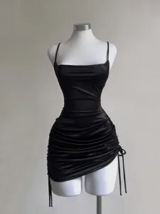 Black satin camisole mini dress featuring side drawstring ruching and chic square neckline details.