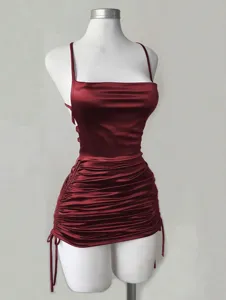 Burgundy satin slip dress detail, featuring side drawstring and chic cowl neck design.