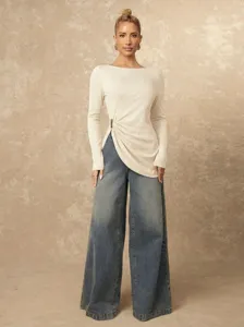 Solid long sleeve top with stylish side buckle detail for women casual commute fashion wear.