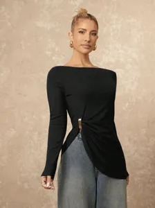 Detailed view of the solid color long sleeve slim fit top showcasing its unique ruched side design.