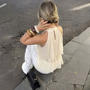 Detailed back view of the elegant halter neck layered chiffon tank top, showcasing open back.