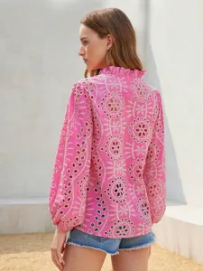 Detailed view of a stylish pink eyelet embroidered ruffle collar lantern sleeve blouse.