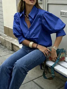 Details of French style royal blue puff sleeve casual shirt with lapel and chic cuffs.