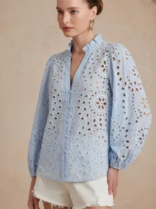 Light blue floral eyelet embroidered blouse featuring a delicate ruffled stand collar.