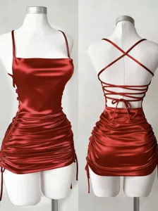 Sexy red satin slip mini dress featuring square neck, backless lace-up and ruched design.