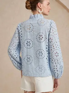 Light blue eyelet embroidered long sleeve blouse with elegant ruffled stand collar detail.