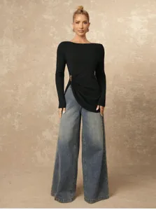 Sleek solid black long sleeve slim top with chic side drape and trendy wide leg denim jeans.
