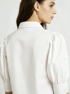 Detail shot of white french style puff sleeve shirt back design, casual commuting style.