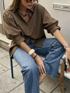 Detail shot of the elegant French style puff sleeve casual shirt with lapel and loose mid-sleeves.