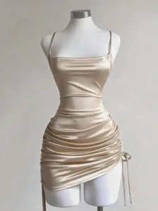 Elegant champagne satin camisole dress with square neck and ruched drawstring design.