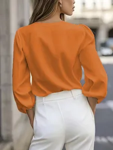 French style office lady orange blouse detail showing the elegant lantern sleeve design.