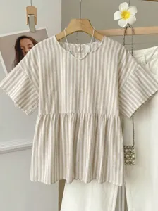 Detail view of casual vertical striped short sleeve blouse with loose A-line hem for daily commute.
