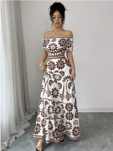 Detailed view of the off-shoulder crop top and tiered maxi skirt with brown floral print.