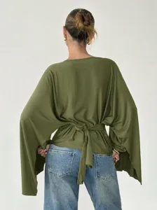 Olive green batwing sleeve blouse back view, showing elegant waist tie detail and stylish fit.