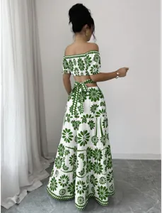 Green and white floral off-shoulder crop top and tiered maxi skirt two-piece set.