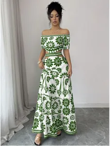 Detailed view of women off shoulder floral crop top and tiered maxi skirt set resort wear.