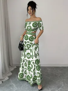 Detailed view of the stylish green floral off-shoulder crop top and cutout maxi dress.