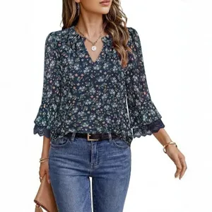 Floral long sleeve blouse detail showcasing delicate lace cuffs and elegant V-neck design.