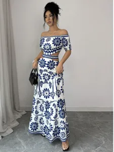 Blue and white floral off-shoulder crop top maxi dress set for women summer resort vacation wear.