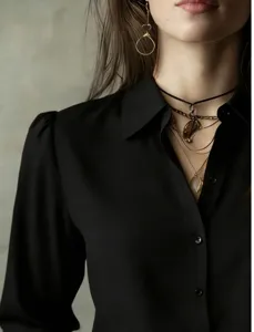Detailed shot of black long sleeve button-down shirt collar, stylish commuter blouse close-up