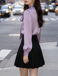 Detail view of the elegant lavender long-sleeve bow tie blouse for chic daily commuting.