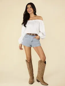 Detailed view of stylish white off-shoulder long sleeve blouse with exquisite ruffled collar.