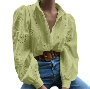 Detailed view of the elegant eyelet embroidered hollow-out blouse with stylish puff sleeves.
