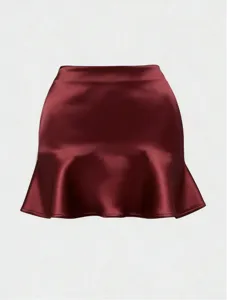 Burgundy satin mini skirt featuring a chic ruffle hem and elegant bodycon silhouette.