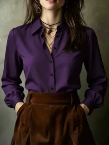 Close up view of purple long sleeve shirt featuring classic lapel and dark buttons.