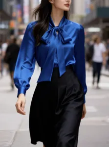 Elegant royal blue satin blouse with bow tie for women commuting style and chic daily wear.