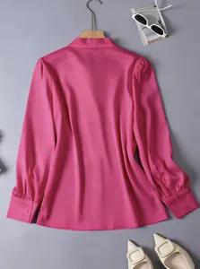 Pink long sleeve blouse for women, elegant commuter style top with smooth drape fabric.