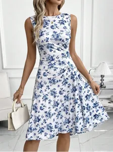 Chic sleeveless midi dress with elegant blue floral print and flattering pleated high waist.