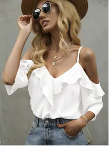 Close-up detail of the white off-the-shoulder ruffle top with delicate thin straps.