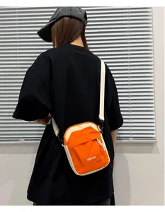 Small lightweight contrast color crossbody phone bag for travel and outdoor sports use