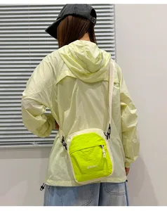 Lightweight nylon crossbody bag, casual colorblock mobile phone pouch, unisex outdoor travel bag.