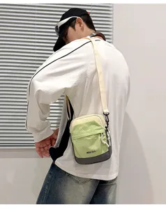 Colorblock sling bag detail showing compact crossbody design for travel and daily outdoor use.