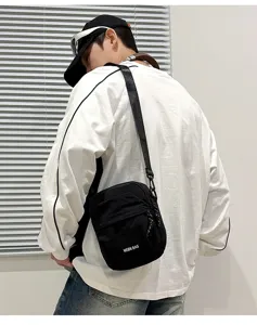 Lightweight casual crossbody bag for men and women, stylish black shoulder bag for travel.
