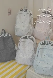 Cute star print backpack detail showcasing large capacity, lightweight and stylish design.