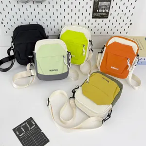 Lightweight colorblock crossbody phone bag casual canvas messenger bag for outdoor travel.
