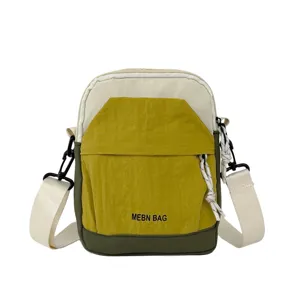 Lightweight crossbody phone bag with color block design, casual canvas shoulder bag for travel.