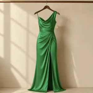 Green satin evening dress detail featuring an elegant one-shoulder design and high slit.