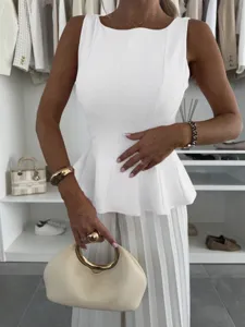 Elegant white sleeveless peplum top for women, chic round neck slim fit summer fashion shirt.