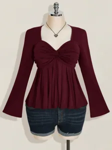 Burgundy long sleeve top with sweetheart neckline and ruched twist front style clothing.