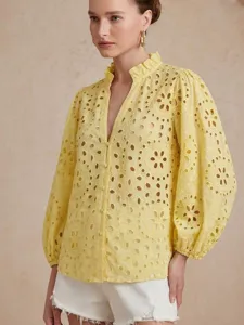 Yellow eyelet embroidered blouse featuring a V-neck, ruffle stand collar, and long lantern sleeves.