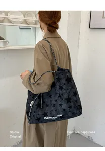 Casual minimalist star print large capacity canvas tote shoulder bag for women daily use.