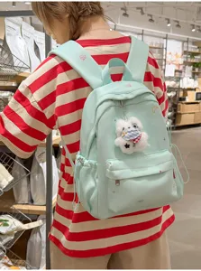 Sac à dos décontracté de style japonais pour femme, joli pendentif en peluche, sac de voyage chic.